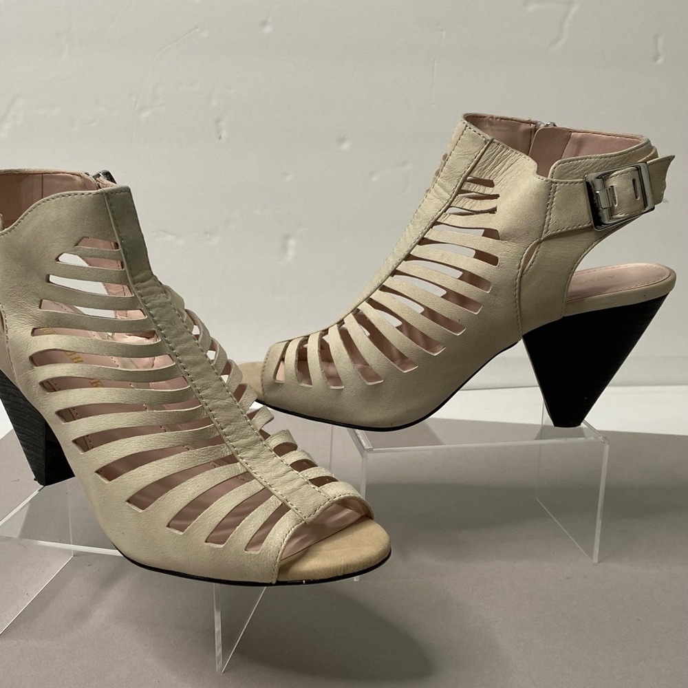 Cream Audrey Brooke Cut-out peep toe low heel bootie w/side zipper and buckle.